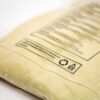 Beiger Pullover in einer ECOBAGS® Textilverpackung mit Warnhinweis-Aufdruck