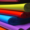 Stapel farbiger FOLIENMAILER® Versandtaschen